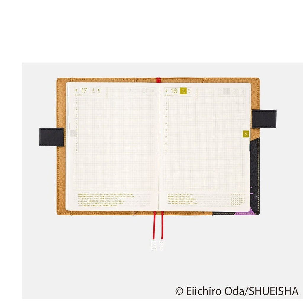 Open Hobonichi Techo A5 grid planner pages with date squares and elastic band