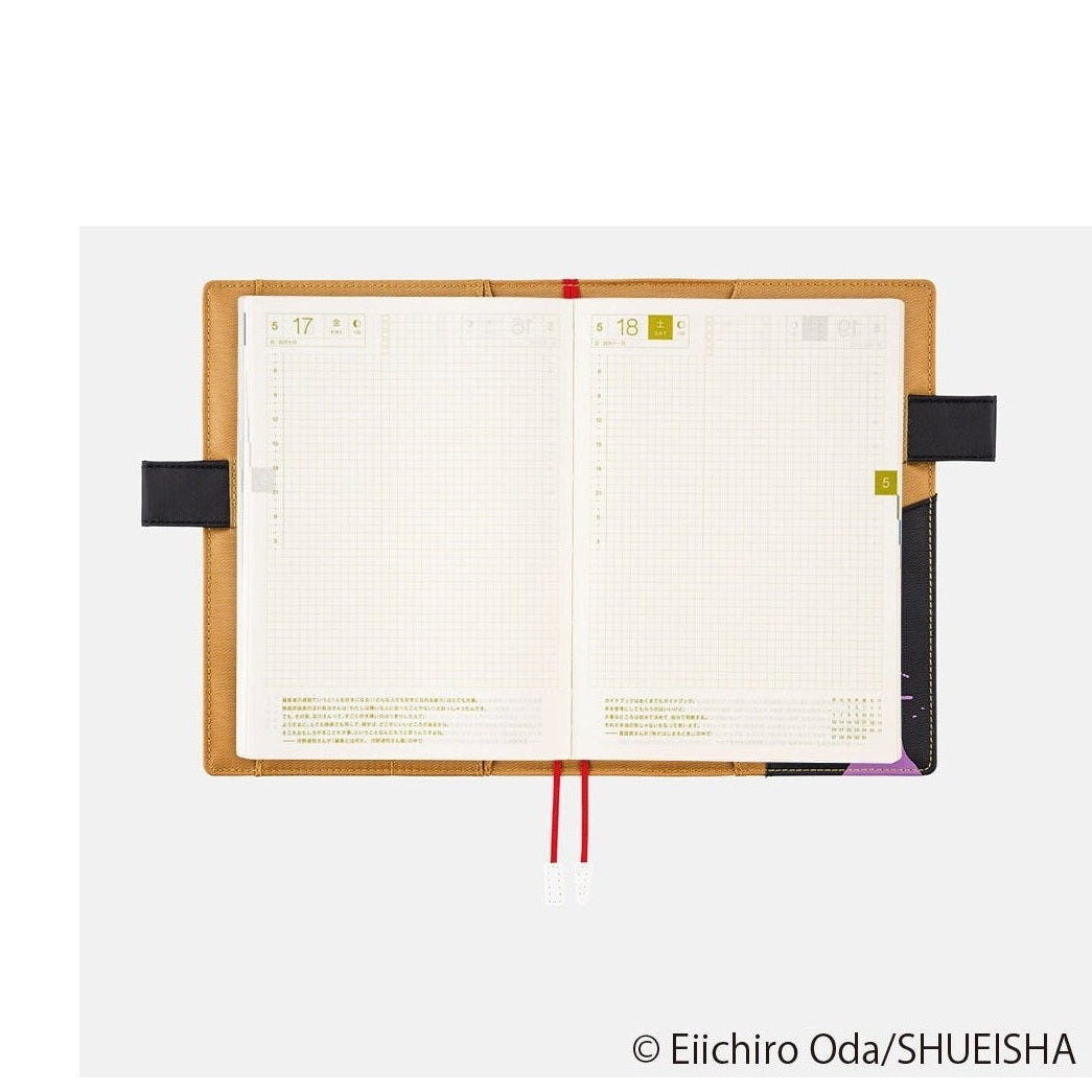 Open Hobonichi Techo A5 grid planner pages with date squares and elastic band