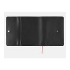 Open Hobonichi Techo A5 One Piece black leather cover showing dual button fasteners