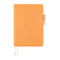 Front exterior of textured mango orange Hobonichi Techo A5 cover with tab closure