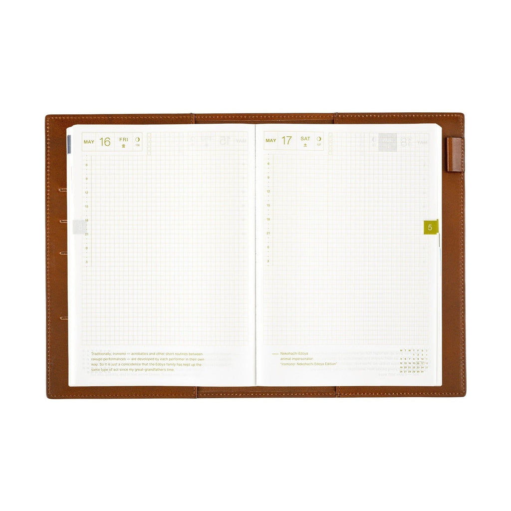 Open Hobonichi Techo A5 planner inside brown leather cover with grid pages