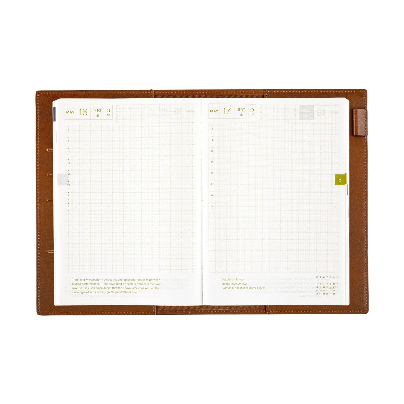 Open Hobonichi Techo A5 planner inside brown leather cover with grid pages