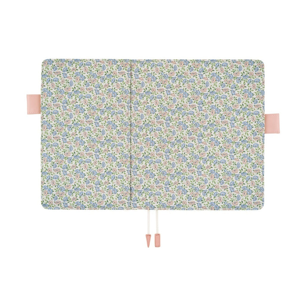 Open Hobonichi A5 cover showing matching floral interior panels and pen slots