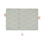 Open Hobonichi A5 cover showing matching floral interior panels and pen slots