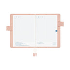 Hobonichi Techo A5 open with grid pages and pink Liberty anemone cover design