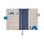 Open Hobonichi Techo A5 planner interior with multiple pockets, spine, and blue wave accents