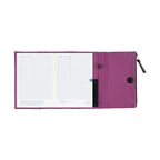 Open Hobonichi Techo A5 purple planner cover with dated notebook pages inside