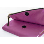 Close-up of gold-rimmed button closures on Hobonichi Techo A5 purple planner cover