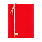 Full front view of upright red Hobonichi Techo A5 cover with white zipper and logo tag