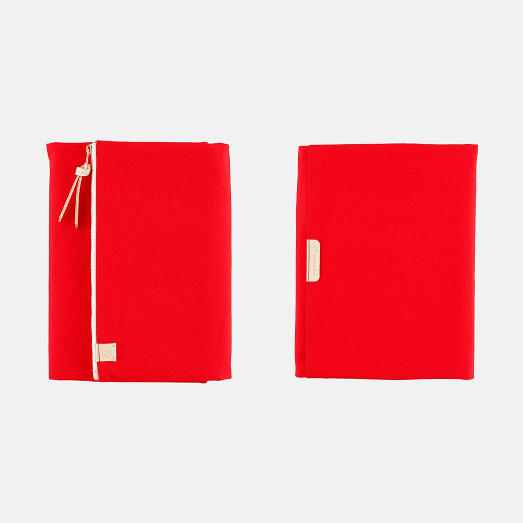 Front and back view of closed red Hobonichi Techo A5 Tragen cover with vertical zipper