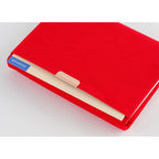 Red Hobonichi Techo A5 Tragen cover with notebook inserted in front gusseted pocket