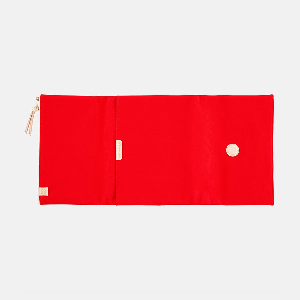 Open red Hobonichi Techo A5 cover showing interior layout with magnetic button closure