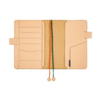 Interior of Hobonichi Techo A5 cover revealing pockets and HOBONICHI brand tag