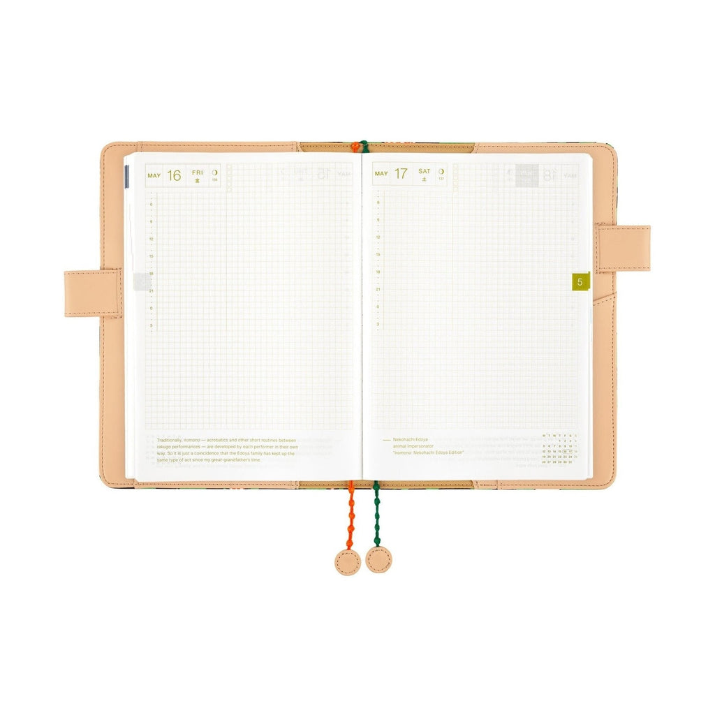 Open Hobonichi Techo A5 planner displaying May dates and beaded string closure