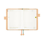 Open Hobonichi Techo A5 planner displaying May dates and beaded string closure