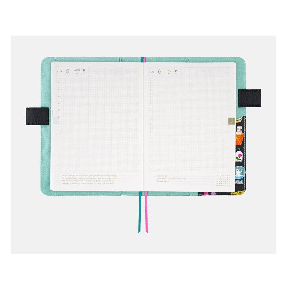 Hobonichi Techo A5 daily planner spread with June dates inside Yumi Kitagishi illustrated cover