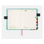 Hobonichi A5 planner pages inside Yumi Kitagishi Little Gifts cover with grid layout and gold tabs