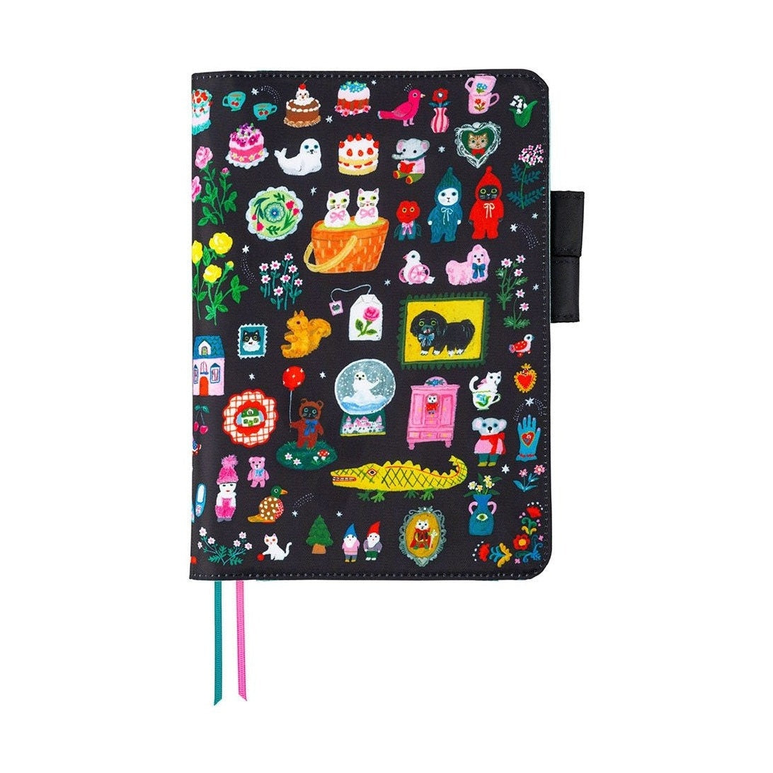Closed Hobonichi A5 Cousins cover with dense colorful whimsical illustration pattern and ribbon bookmarks