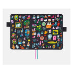 Flat lay open Hobonichi A5 cover displaying symmetrical Yumi Kitagishi pattern with cats and miniature scenes