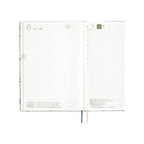 Hobonichi Techo A5 2025 June 6 daily layout page with large date number, hourly grid, and ribbon bookmarks