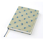 Closed Hobonichi Techo A5 2025 Snake Toy diary with olive-green textured cover, blue snake pattern, and dual ribbons