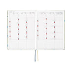Hobonichi Techo A5 2025 diary July to December 2025 monthly spread with bilingual headers and color-coded days