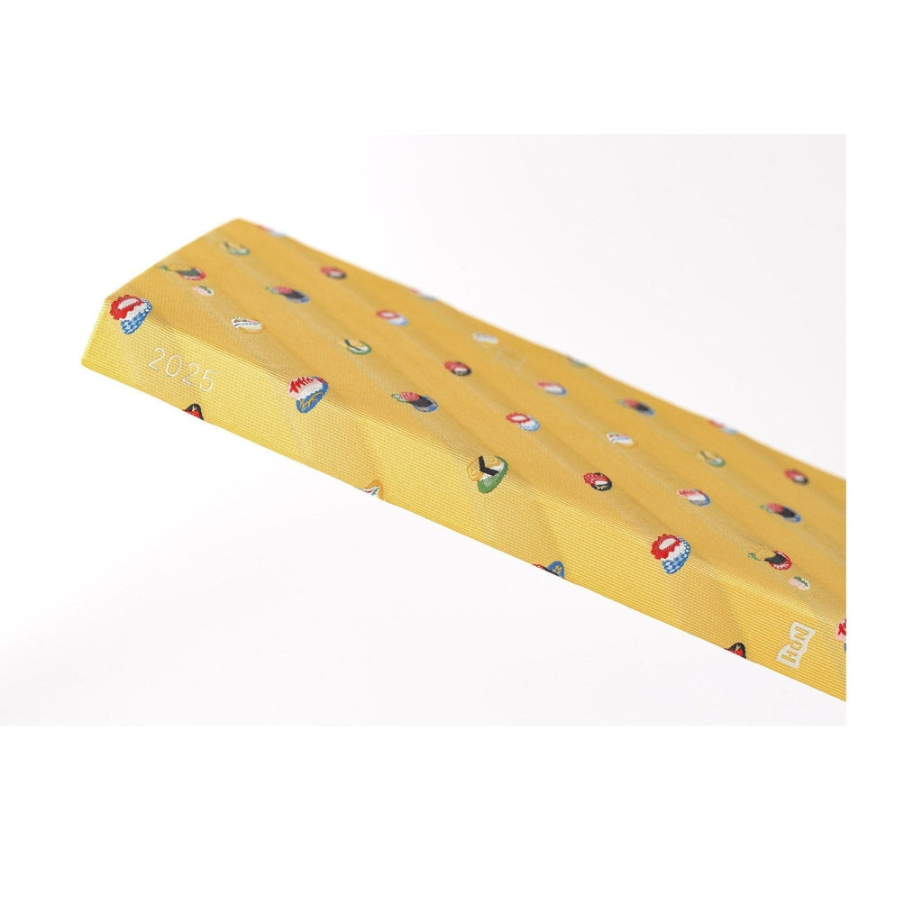 Angled view of closed 2025 Hobonichi Techo A5 with sushi pattern spine