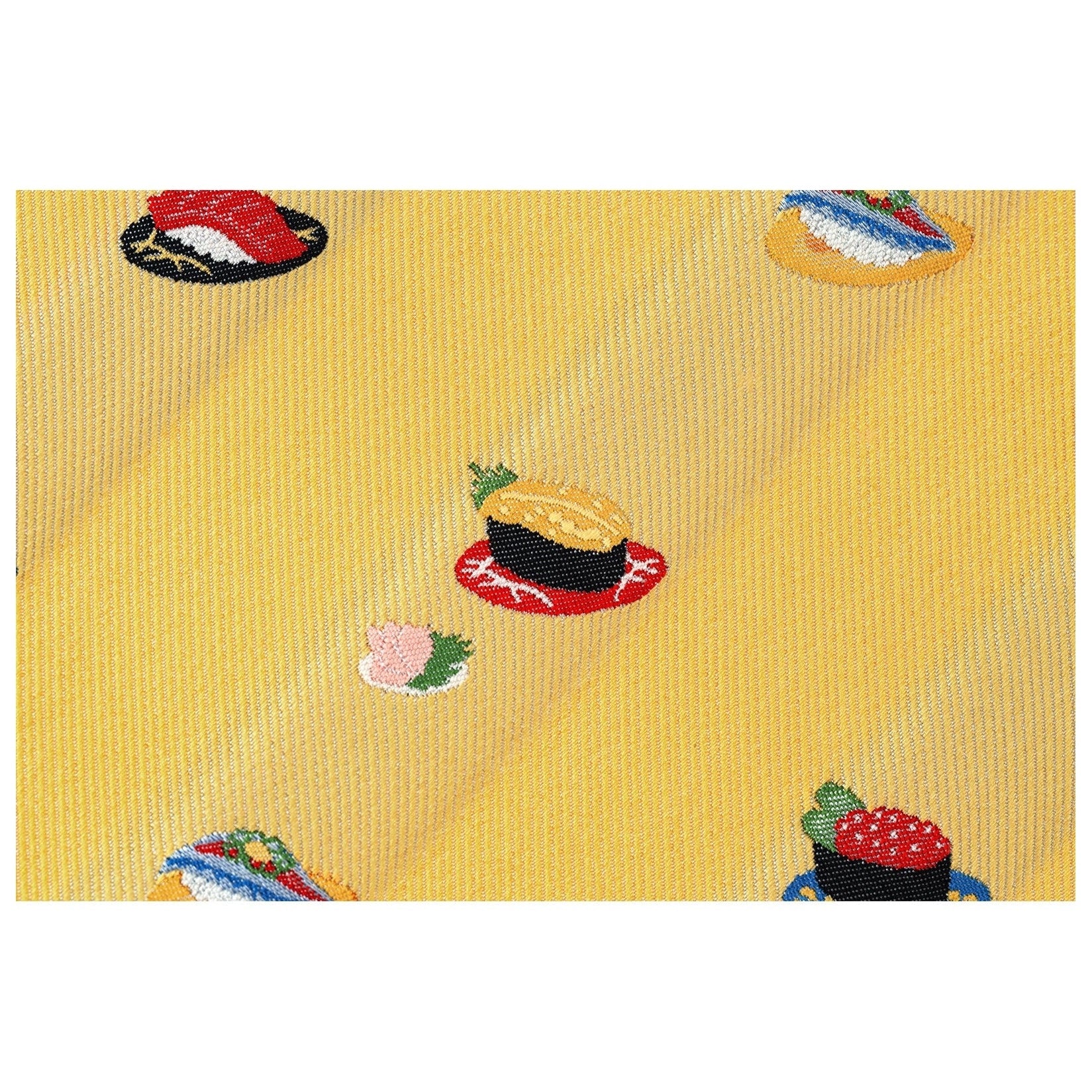 Close-up of woven fabric texture on yellow Hobonichi Techo sushi cover