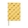 Front view of closed yellow Hobonichi Techo A5 2025 diary with sushi design