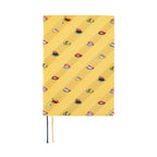 Front view of closed yellow Hobonichi Techo A5 2025 diary with sushi design