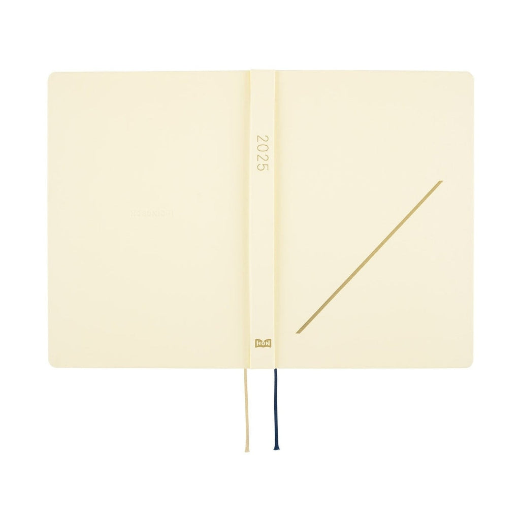 Hobonichi Techo A5 blank page view with gold diagonal line and dual ribbon markers