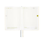 Hobonichi Techo A5 May daily spread with gold foil quote and yellow tab marker