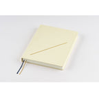 Hobonichi Techo A5 closed diary with matte cream cover and single gold slash line