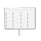 Hobonichi Techo A6 2025 open spread showing April to July monthly calendar in Japanese