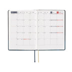 Hobonichi Techo A6 April 2025 monthly spread with bilingual English Chinese calendar grid
