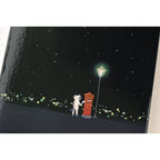 Hobonichi Techo A6 2025 back cover art of cat mailing letter at street lamp under stars