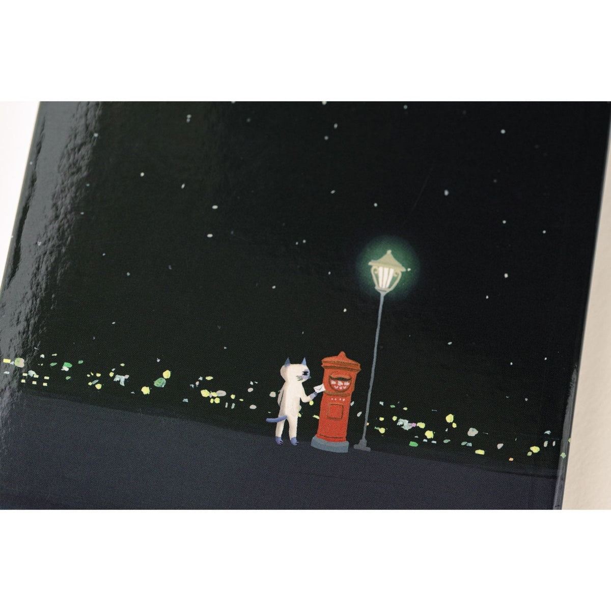 Hobonichi Techo A6 2025 back cover art of cat mailing letter at street lamp under stars