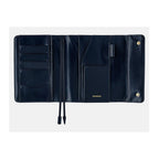 Interior view of navy Hobonichi cover with card slots, elastic band, and embossed logo