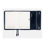 Open navy leather cover displaying June diary dates, pen pocket, and elastic straps