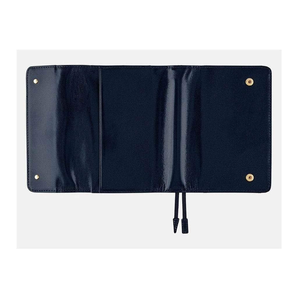 Fully open tri-fold navy leather cover showing interior layout and pen loop