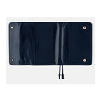 Fully open tri-fold navy leather cover showing interior layout and pen loop