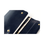 Open navy leather notebook cover holding A6 diary and silver pen in pocket