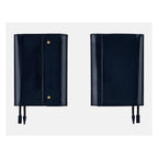 Front and back views of closed deep navy tri-fold A6 leather cover with elastic straps