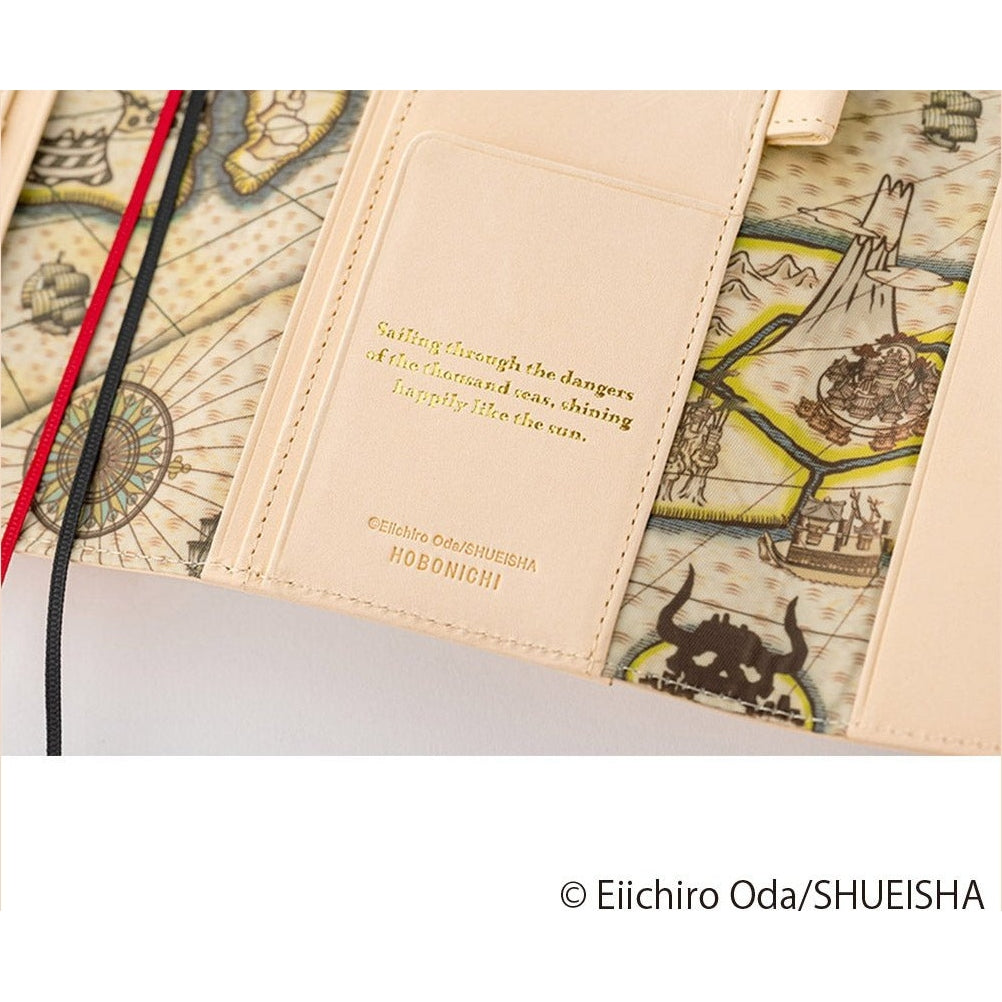 Inner pocket detail on Hobonichi Techo A6 One Piece cover with gold embossed quote and map background
