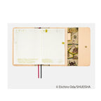 Open Hobonichi Techo A6 One Piece diary displaying May dates and colorful volcano map illustration