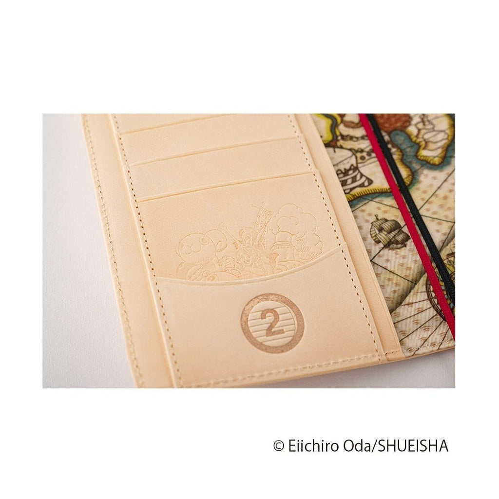 Close-up of embossed character detail and number two emblem on beige One Piece diary cover