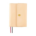 Front view of closed A6 One Piece Thousand Sunny notebook cover with textured beige material
