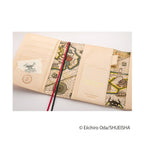 Open Hobonichi Techo A6 One Piece Thousand Sunny cover with nautical map interior and leather-like beige finish