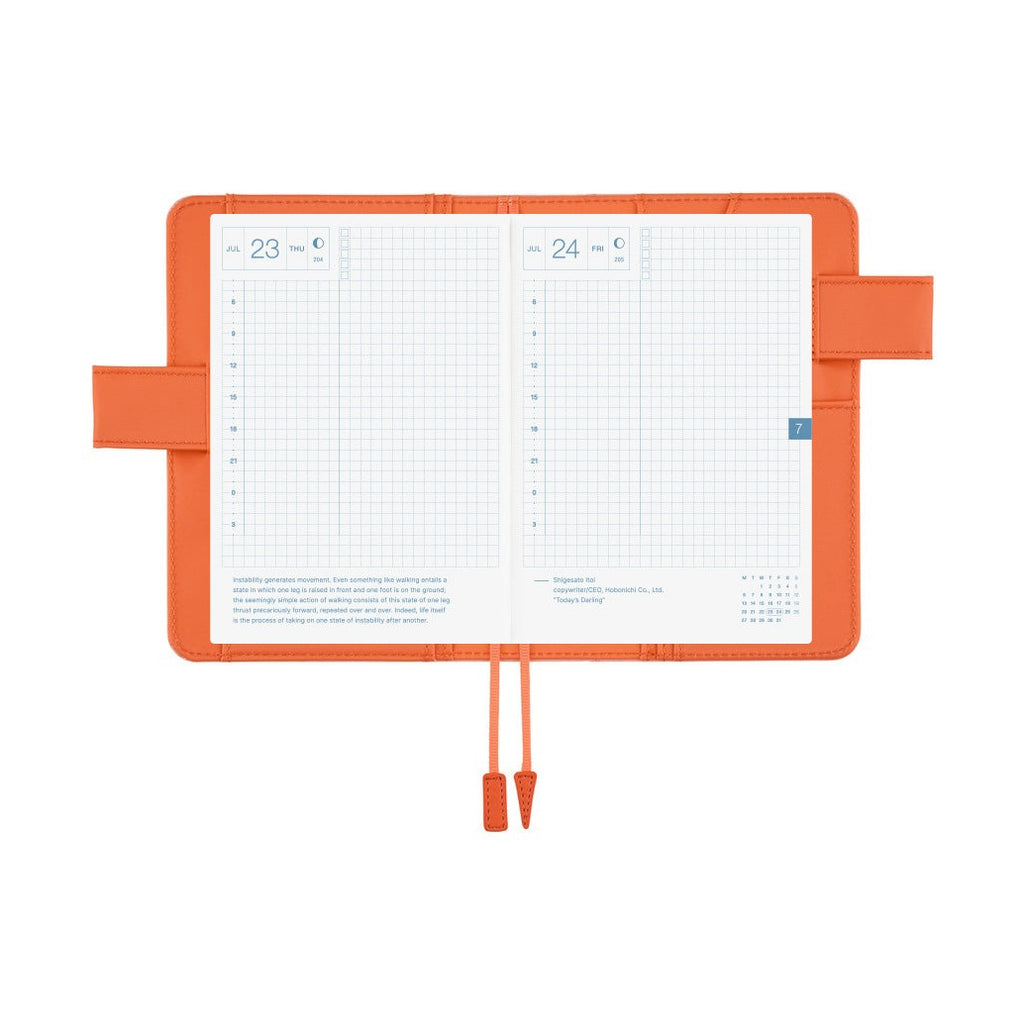 Open Hobonichi Techo A6 planner cover in airy flamingo pink with grid pages and orange clasp