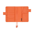 Orange interior of Hobonichi A6 planner cover showing card slots, pockets, and HOBONICHI label